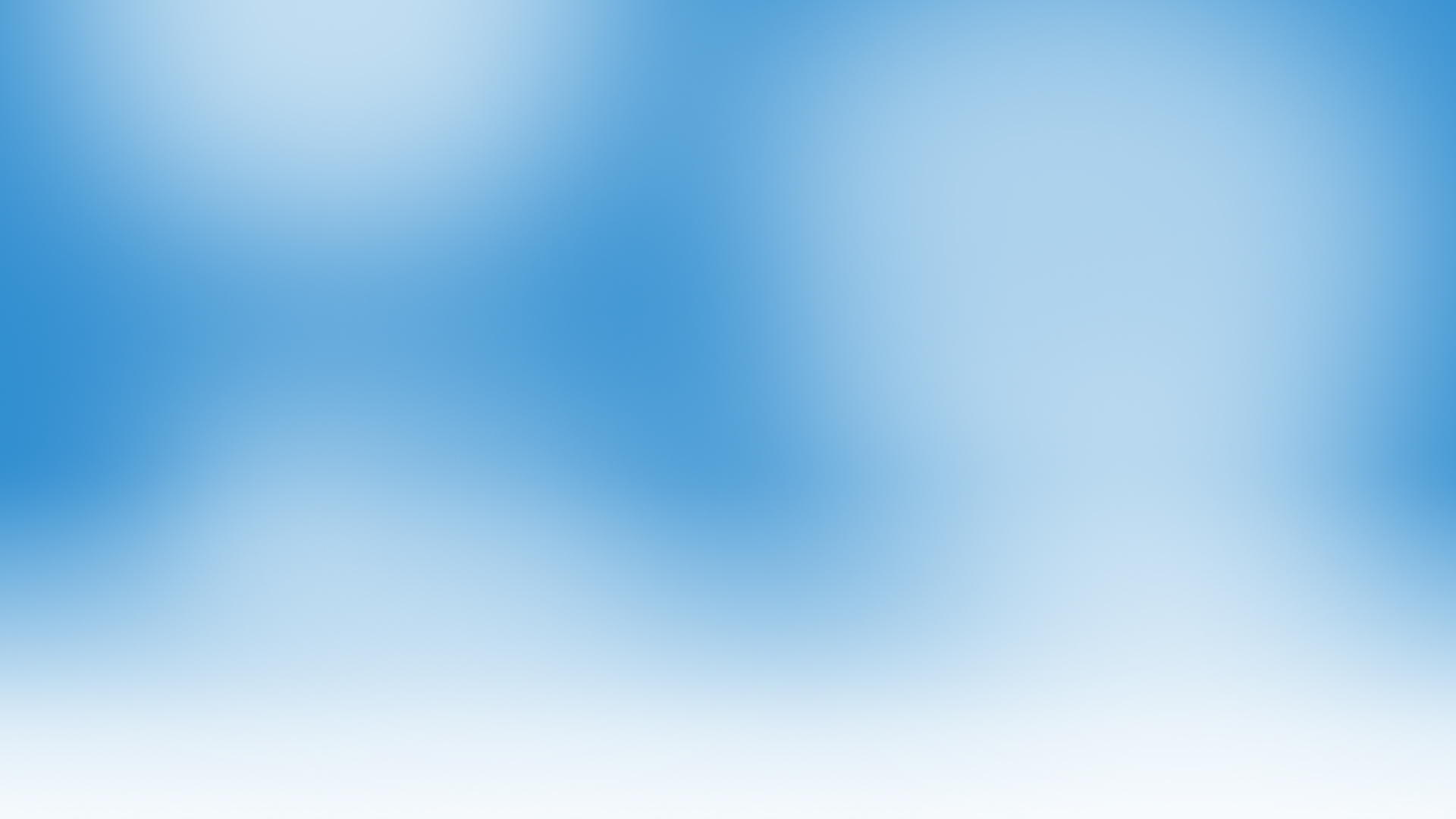 Blue and white abstract blurred background with soft gradient transitions, creating a calm and smooth visual effect. There are no distinct shapes or objects visible.